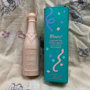 Avon Products Cheers! Celebrate the holiday season (1991) Champagne shaped soap.